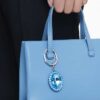 Sleutelhanger met ovale slijpvorm, blauw, gemengde metalen afwerking Sleutelhanger met ovale slijpvorm, blauw, gemengde metalen afwerking